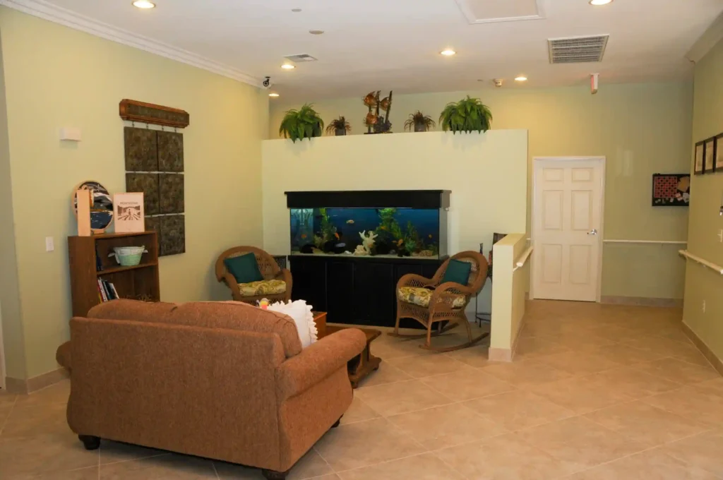 A sitting area in Nevada Memory Care, where a sofa, chairs, and some other room stuff you can see.